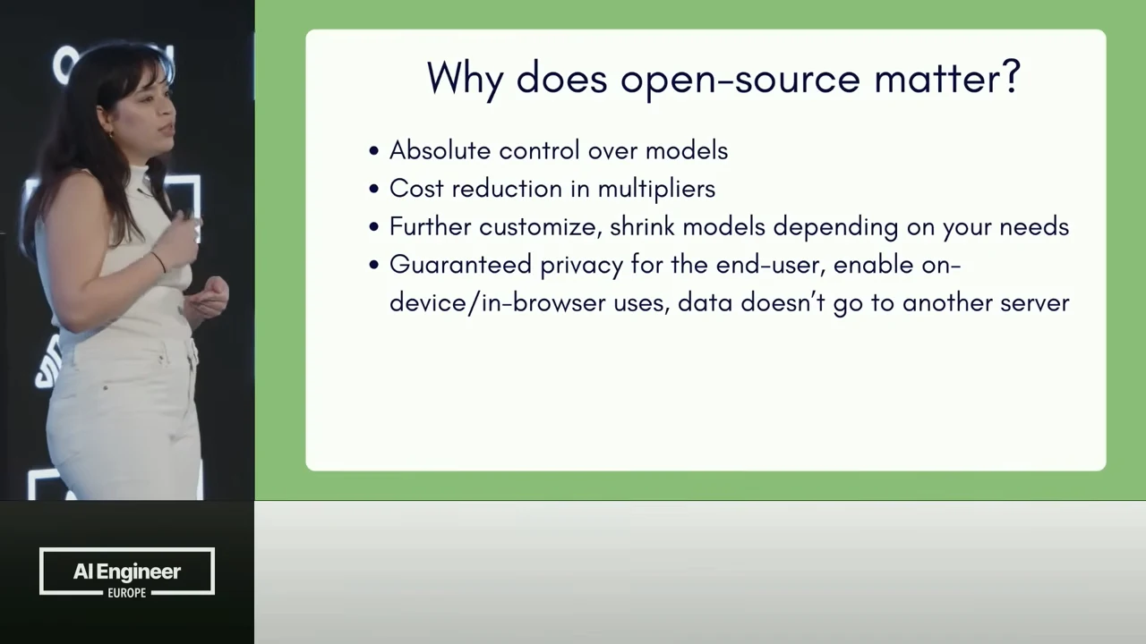 Slide listing control over models, cost reduction, customization and on-device or in-browser privacy, with the speaker at left.