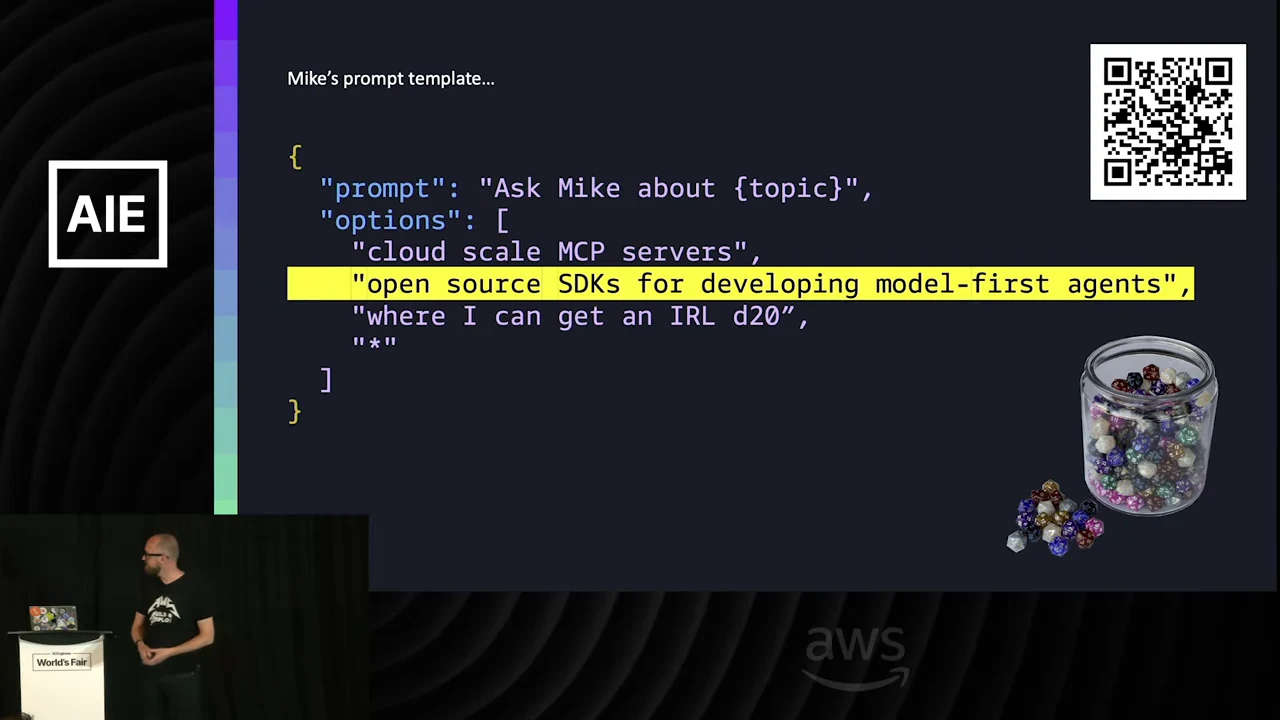 Mike’s prompt-template slide lists discussion topics, highlights open source SDKs for developing model-first agents, and shows a QR code and jar of dice.