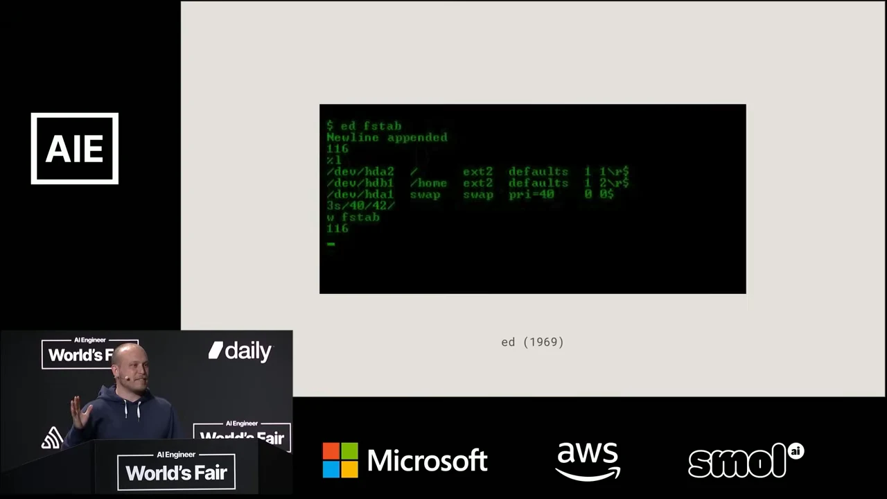 Slide with a black terminal screenshot containing green command and file text, captioned “ed (1969).”