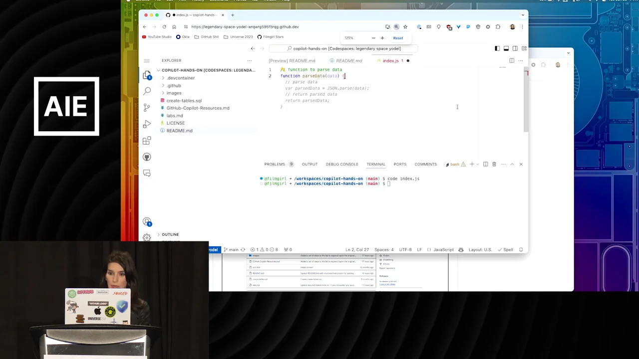 Browser-based VS Code editor showing a parsing comment, a function declaration, and pale suggested code beneath it.