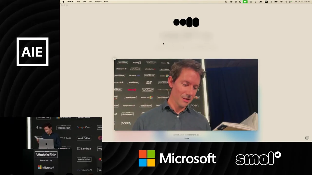 ChatGPT voice interface above a camera view of the presenter looking down at an open book.