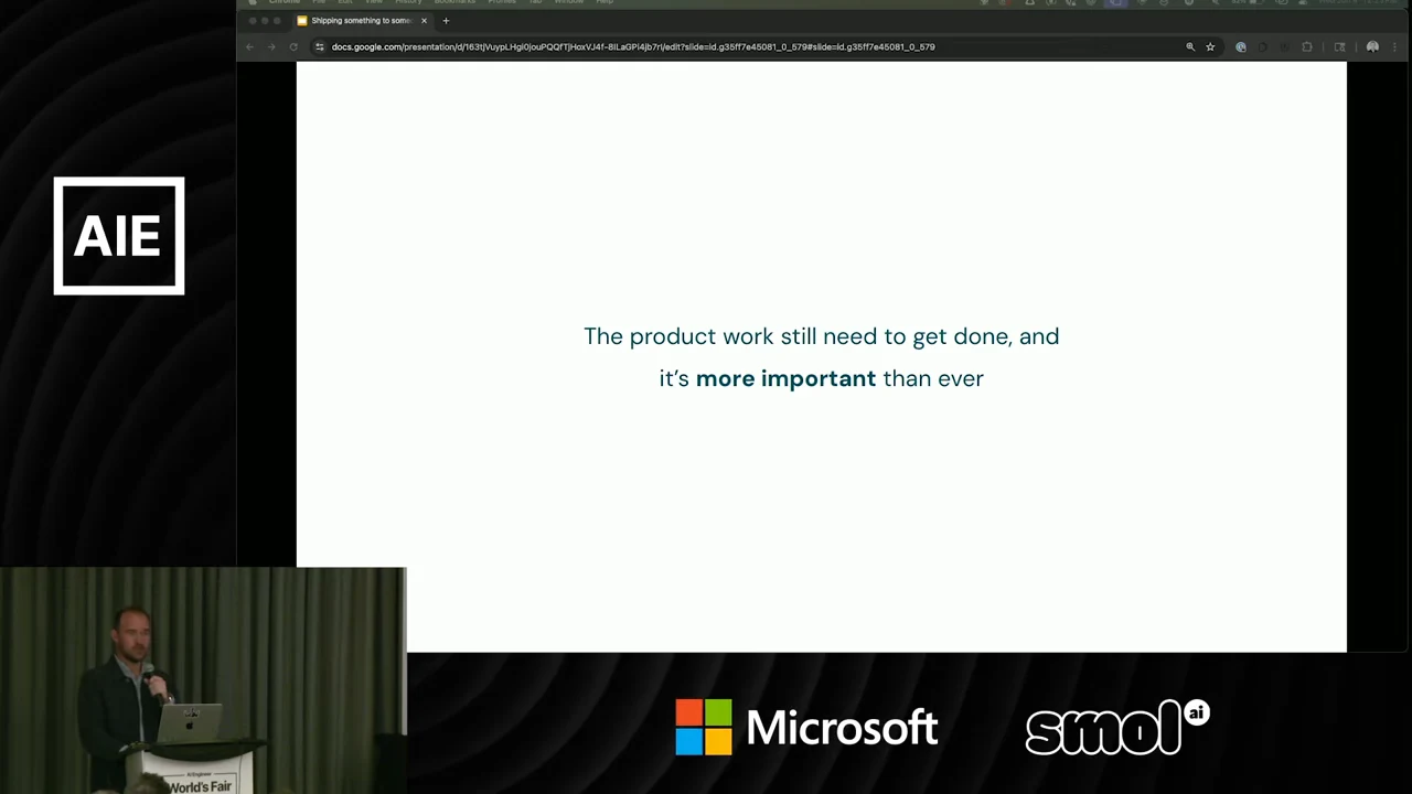 White slide stating that product work still needs to get done and is “more important” than ever, with a speaker inset.