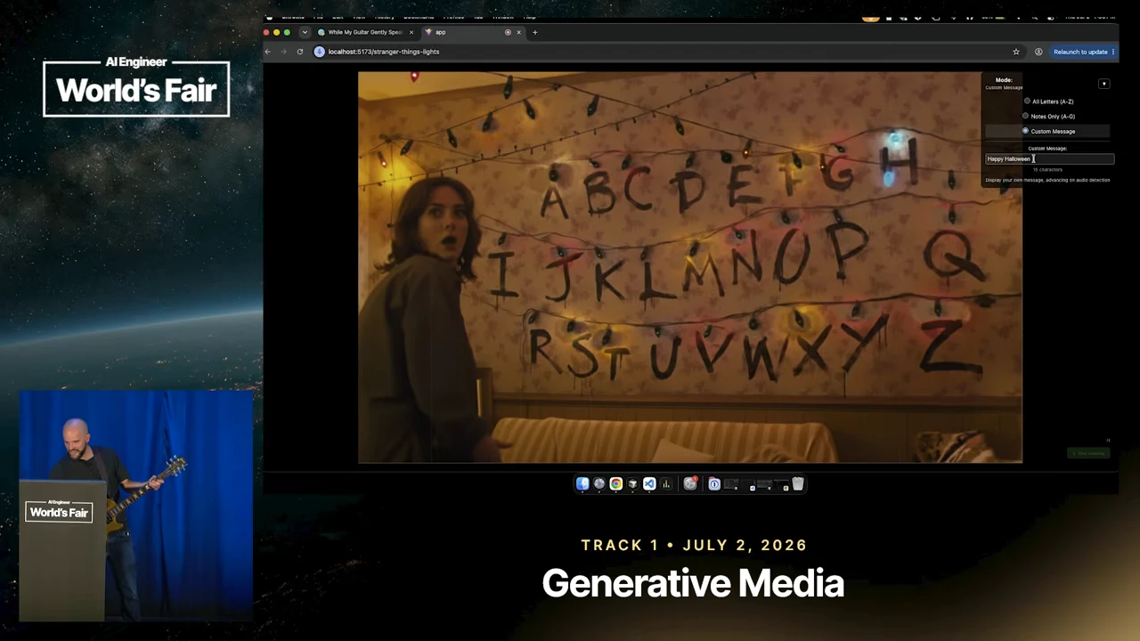 Browser demo with three rows of painted letters, colored string lights, a bright light near I, and controls at the upper right.