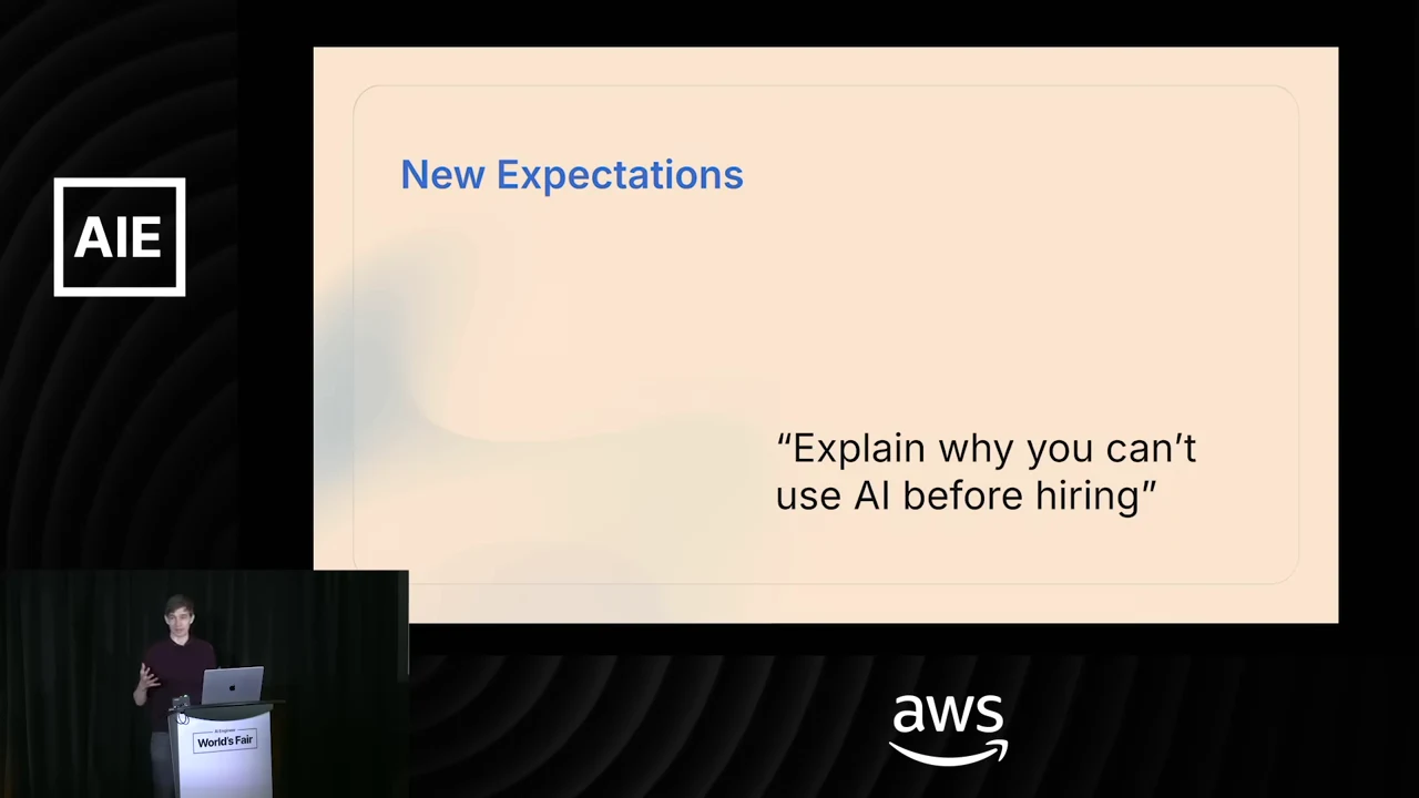 Slide titled “New Expectations” displaying the quote “Explain why you can’t use AI before hiring.”