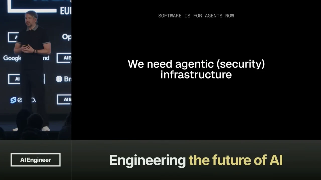 Black slide reading “Software is for agents now” above “We need agentic (security) infrastructure,” with the speaker at left.