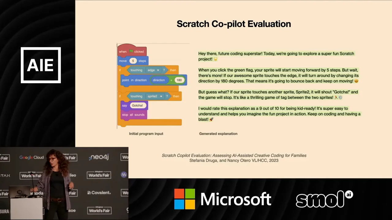 Scratch Co-pilot Evaluation slide showing a Scratch block program on the left and its generated explanation on the right, with a publication citation below.