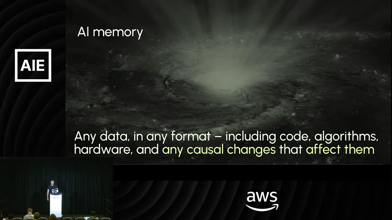 AI memory slide over a galaxy image, defining memory as any data in any format, including code, algorithms, hardware, and causal changes that affect them.