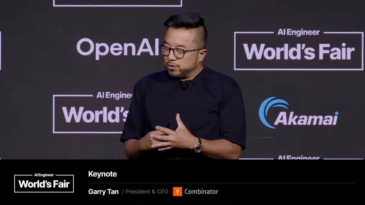 Speaker holding his hands together, with a lower third identifying Garry Tan as President and CEO of Y Combinator.