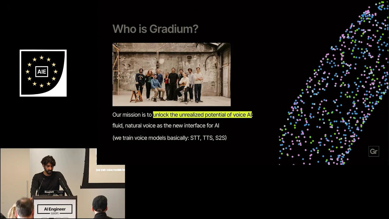 “Who is Gradium?” slide with a team photograph, mission statement, STT, TTS and S2S text, and a colorful dotted graphic.