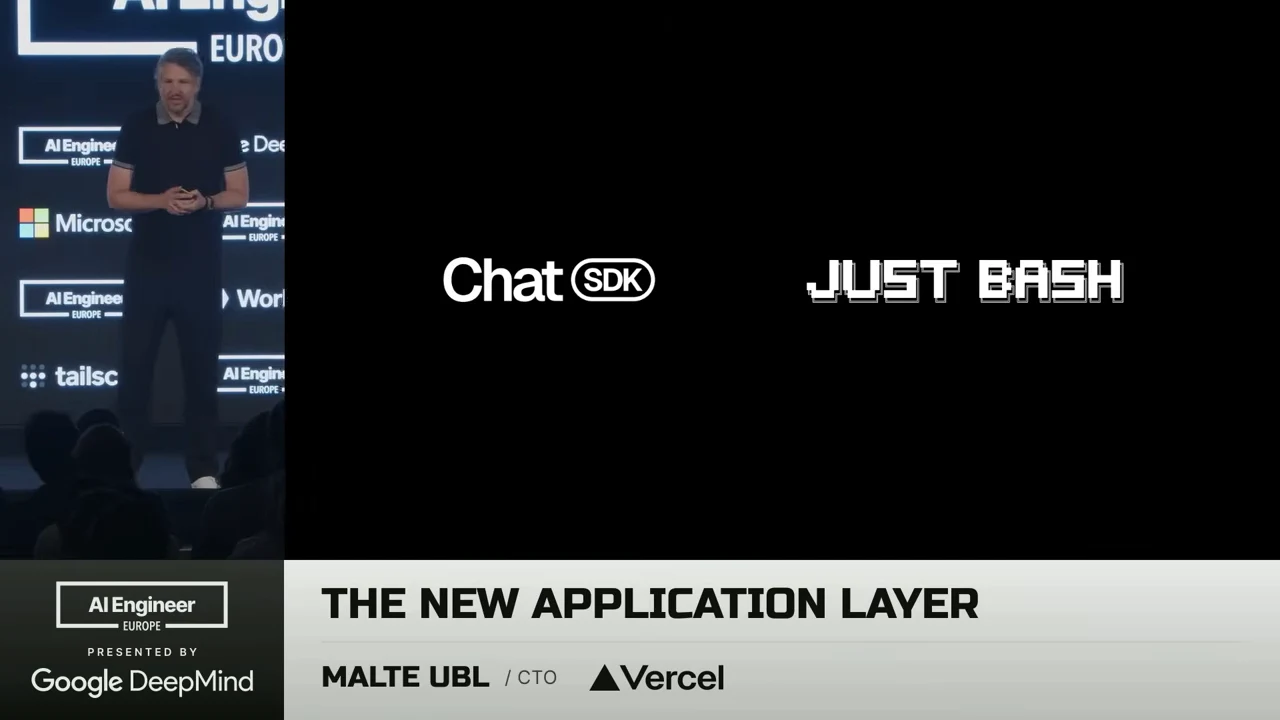 The speaker beside a black slide displaying the Chat SDK and JUST BASH logos.
