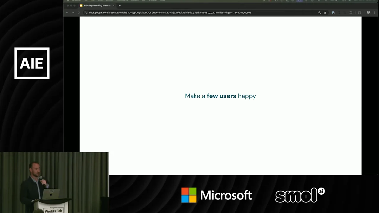 White slide reading “Make a few users happy,” with “few users” bolded and the speaker visible at lower left.