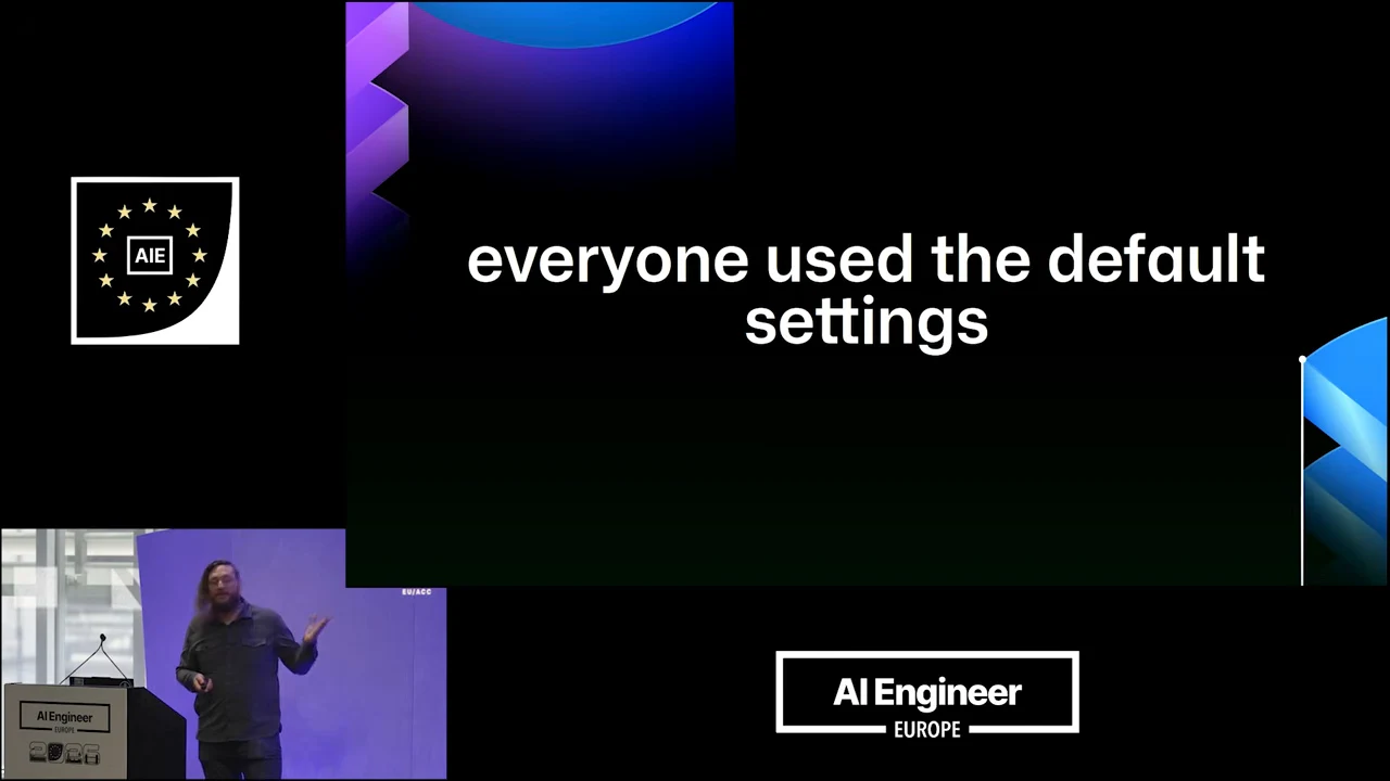 Black slide with large white text reading “everyone used the default settings,” blue and purple corner graphics, and a speaker inset.