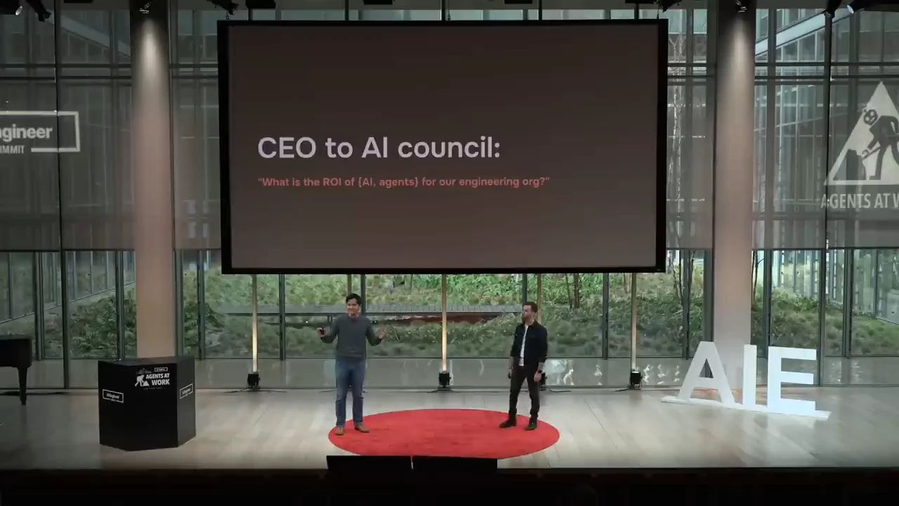 Two presenters beneath a slide headed “CEO to AI council,” asking about AI ROI for the engineering organization.