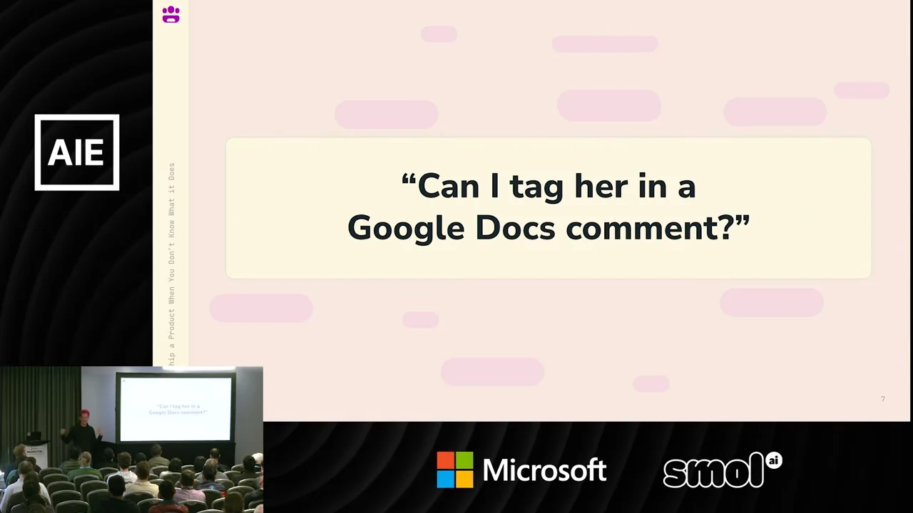 Slide displaying the question “Can I tag her in a Google Docs comment?” in a cream box on a pink background.